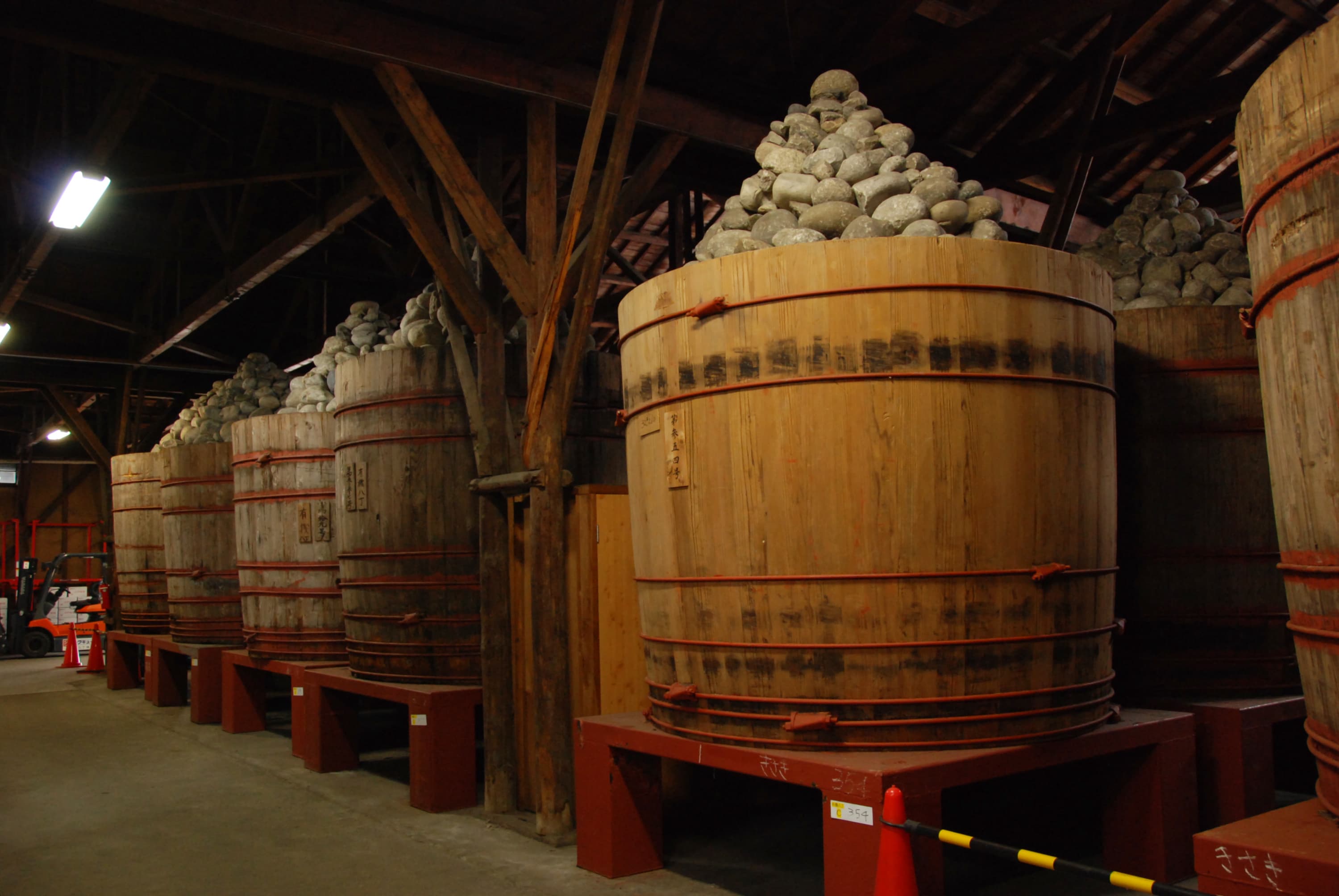 Large wooden miso fermentation vats in Japan